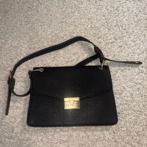 Chic Black Crossbody Bag with Gold Accents